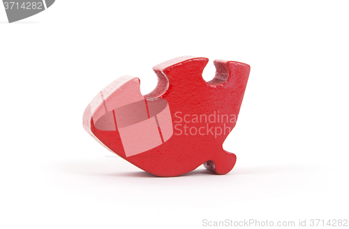 Image of Closeup of big red jigsaw puzzle piece