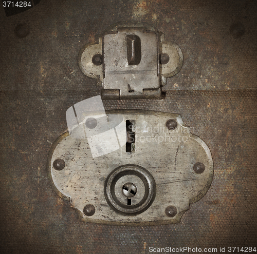 Image of Old canvas trunk lock close up