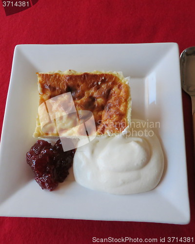 Image of Cheese cake with jam and cream
