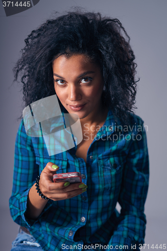 Image of Woman texting on her cell phone