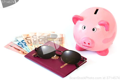 Image of Passport with money and piggy bank