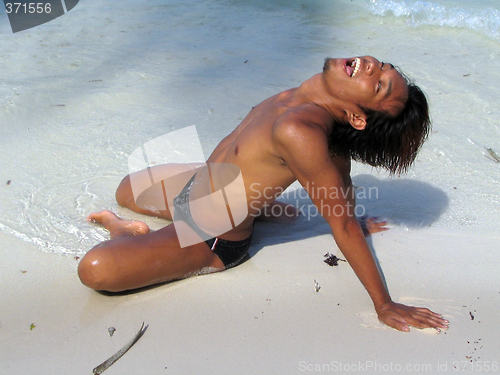 Image of Suntanning tourist on beach