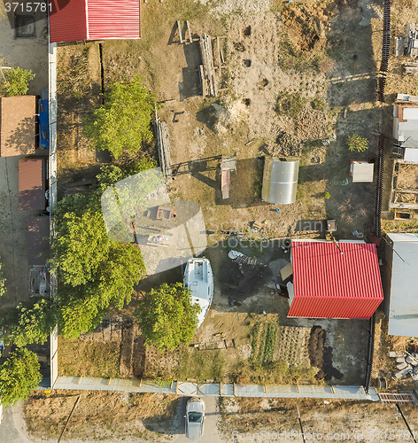 Image of Aerial view on ground plot with cottage. Russia