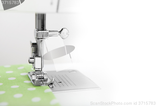 Image of sewing green fabric