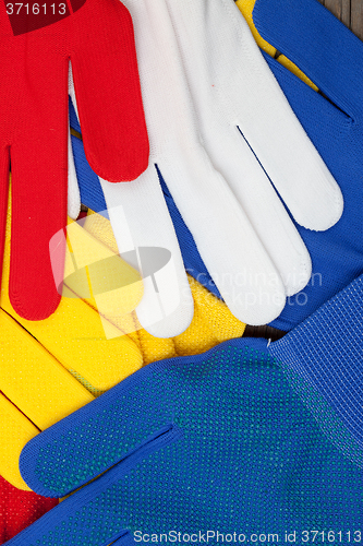 Image of colored work gloves on the display