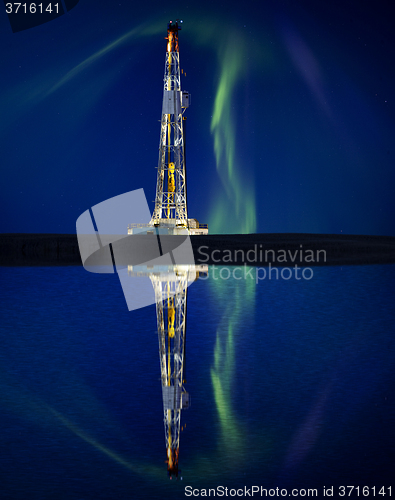 Image of Drilling Rig and Lake Reflection