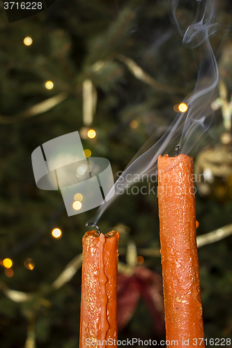 Image of Candles in front of the Christmas tree