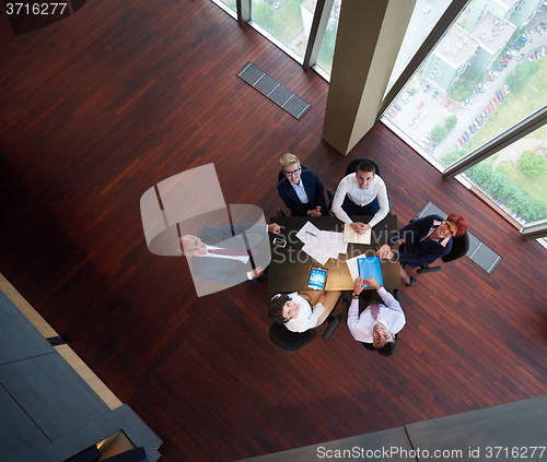 Image of top view of business people group throwing dociments in air