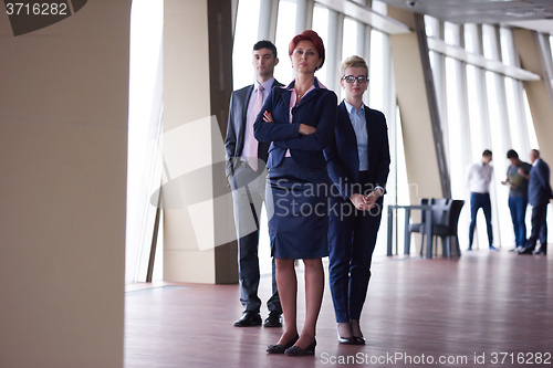 Image of diverse business people group with redhair  woman in front