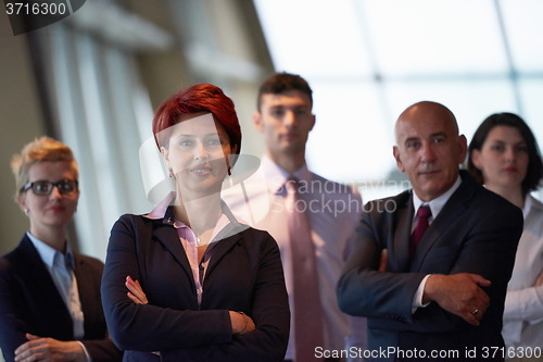 Image of diverse business people group with redhair  woman in front