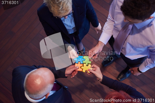 Image of assembling jigsaw puzzle