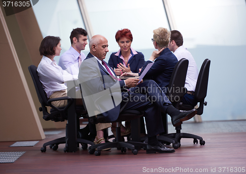 Image of business people group on meeting at modern bright office