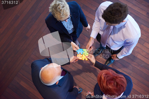 Image of assembling jigsaw puzzle