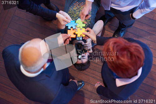 Image of assembling jigsaw puzzle