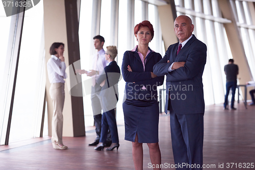 Image of diverse business people group with redhair  woman in front