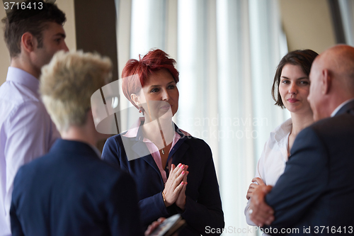 Image of business people group on meeting at modern bright office