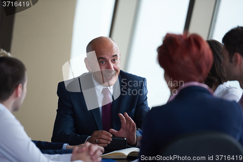 Image of business people group on meeting at modern bright office