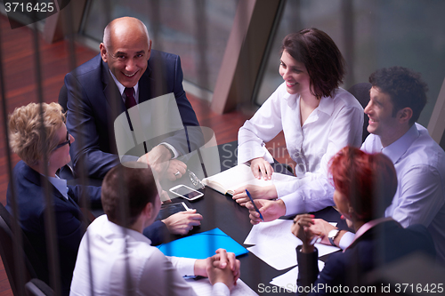 Image of business people group on meeting at modern bright office