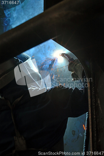 Image of worker welding 