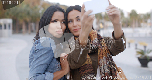 Image of Two gorgeous women posing for a selfie