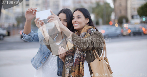 Image of Two gorgeous women posing for a selfie