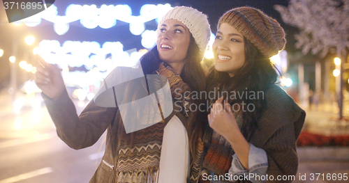 Image of Two vivacious young women laughing and having fun