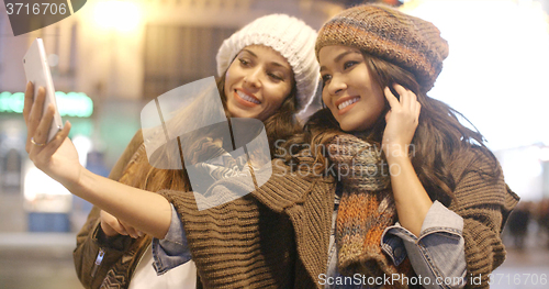 Image of Two vivacious women taking a selfie