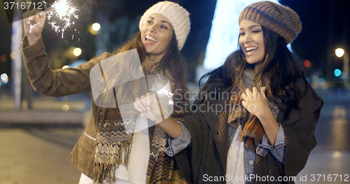 Image of Two young women celebrating Christmas