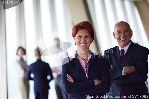 Image of diverse business people group with redhair  woman in front