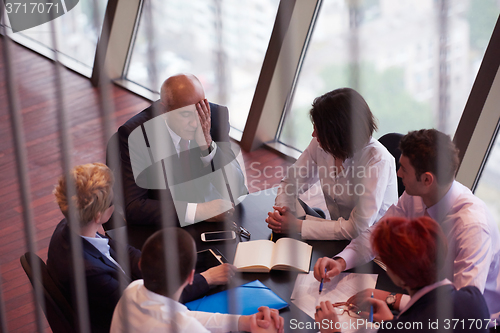 Image of business people group on meeting at modern bright office