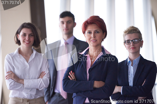 Image of diverse business people group with redhair  woman in front