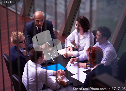 Image of business people group on meeting at modern bright office