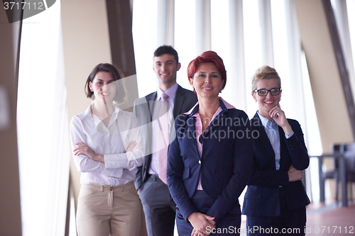 Image of diverse business people group with redhair  woman in front