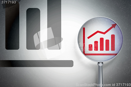 Image of Advertising concept:  Growth Graph with optical glass on digital background