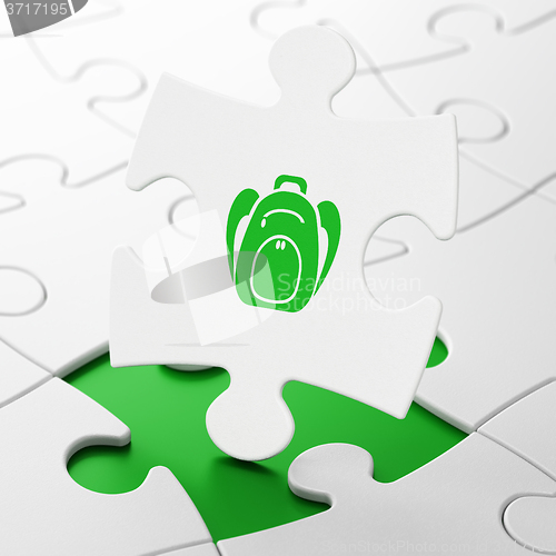 Image of Learning concept: Backpack on puzzle background