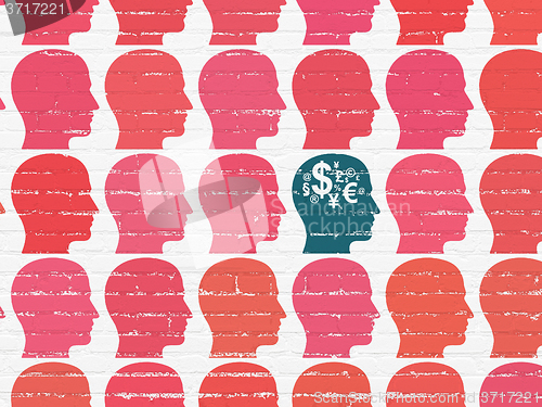 Image of Finance concept: head with finance symbol icon on wall background