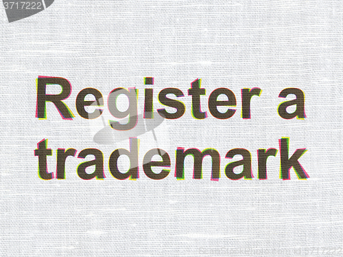 Image of Law concept: Register A Trademark on fabric texture background