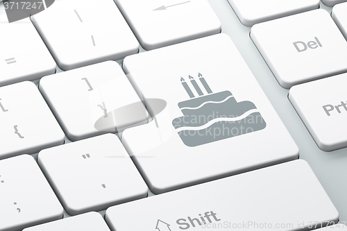 Image of Entertainment, concept: Cake on computer keyboard background