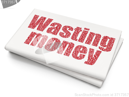 Image of Money concept: Wasting Money on Blank Newspaper background