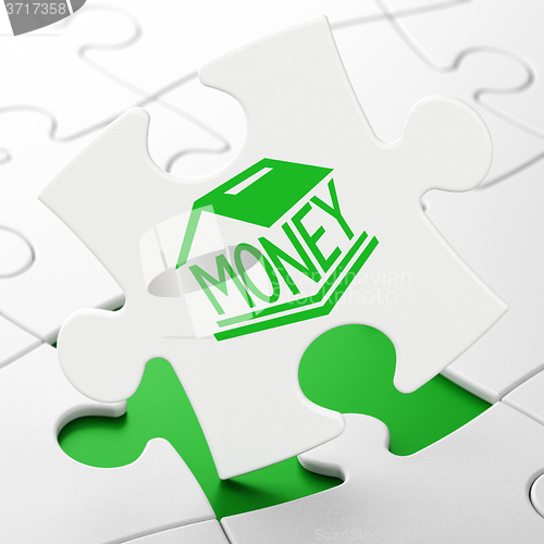 Image of Banking concept: Money Box on puzzle background