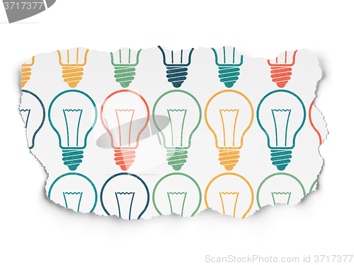 Image of Finance concept: Light Bulb icons on Torn Paper background