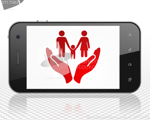 Image of Insurance concept: Smartphone with Family And Palm on display