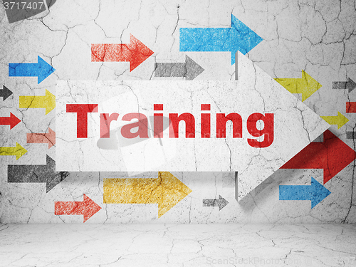 Image of Studying concept: arrow with Training on grunge wall background