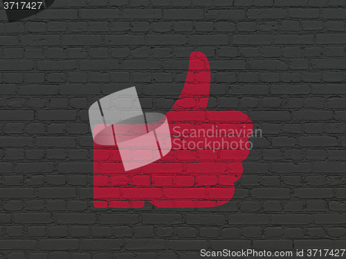 Image of Social media concept: Thumb Up on wall background