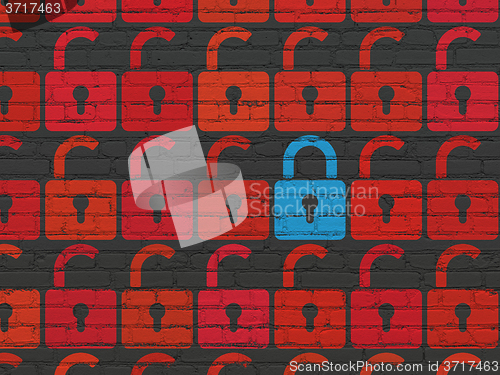 Image of Security concept: closed padlock icon on wall background
