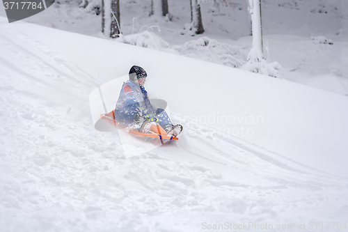 Image of Child sledding