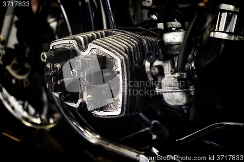 Image of motorcycle engine being repaired