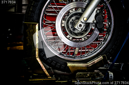 Image of motorcycle wheel in holder