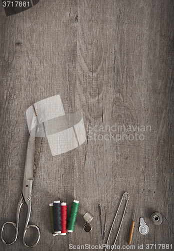 Image of tailor wooden background