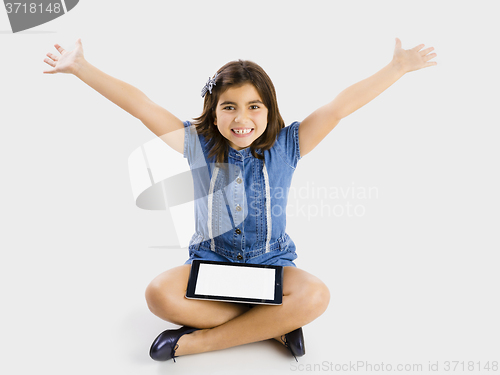 Image of Young girl using a tablet
